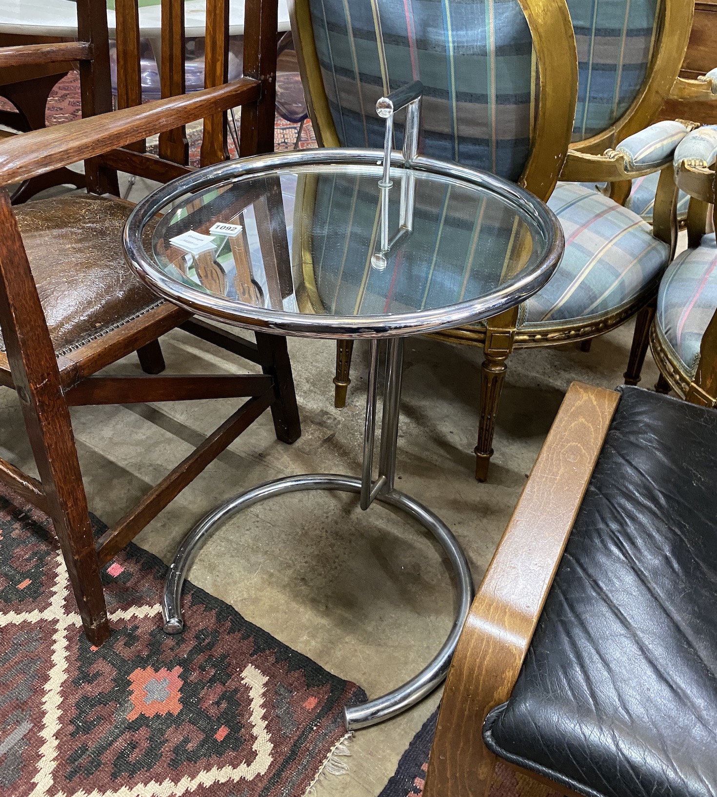 An Eileen Gray style circular chrome and plate glass telescopic coffee table, diameter 48cm